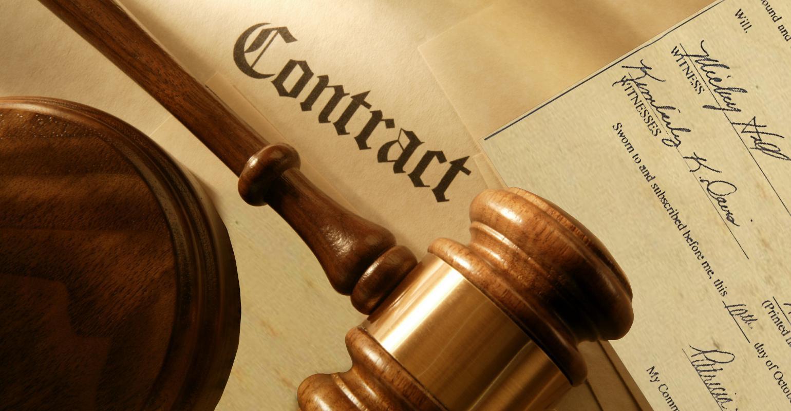 Image of a gavel resting on a contract